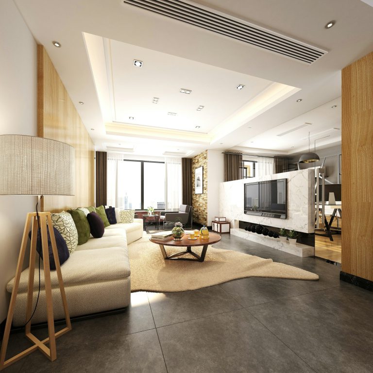Salon moderne avec canapé gris, cheminée, et une décoration accueillante.